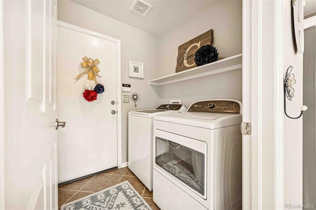 2476 S Gibralter Way, Aurora, CO 80013 - laundry room featuring washing machine and clothes dryer and tile patterned flooring