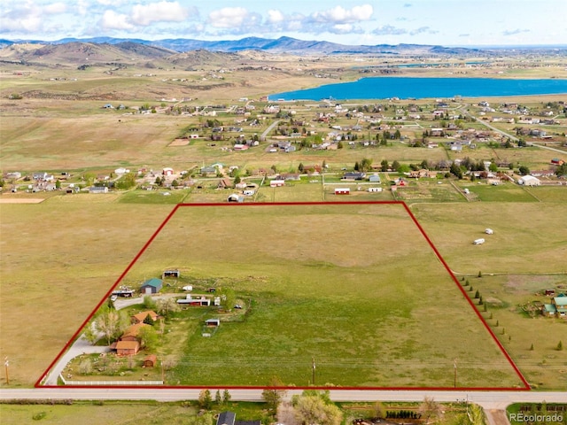 6310 W County Road 4, Berthoud, CO 80513 - aerial overview of property's location featuring property boundaries highlighted and a water and mountain view