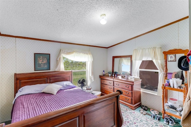 6310 W County Road 4, Berthoud, CO 80513 - bedroom featuring crown molding, lofted ceiling, a textured ceiling, and wallpapered walls