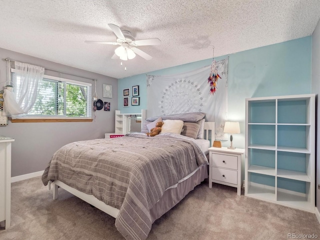 7379 S Lafayette Cir W, Centennial, CO 80122 - carpeted bedroom with a textured ceiling, ceiling fan, and baseboards