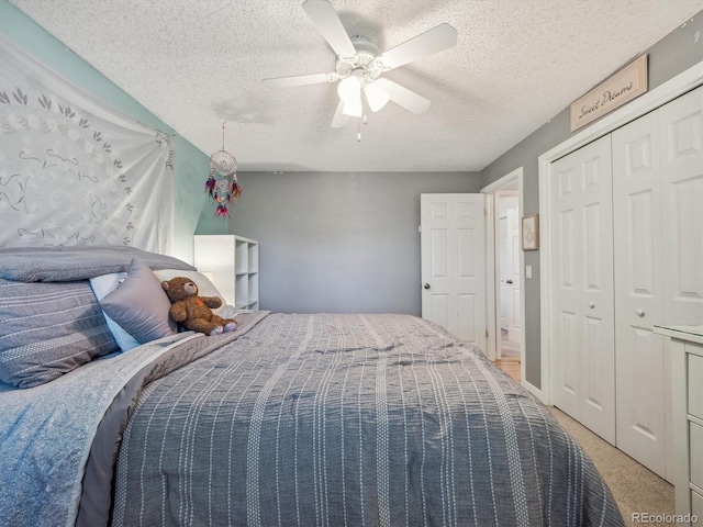 7379 S Lafayette Cir W, Centennial, CO 80122 - bedroom with light colored carpet, a textured ceiling, ceiling fan, and a closet