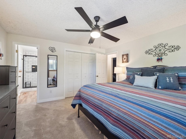 7379 S Lafayette Cir W, Centennial, CO 80122 - bedroom with light colored carpet, a textured ceiling, a closet, baseboards, and a ceiling fan