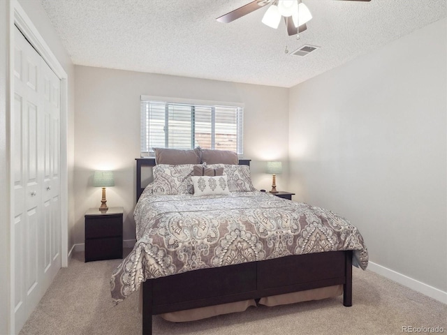 7379 S Lafayette Cir W, Centennial, CO 80122 - bedroom with carpet flooring, a closet, a textured ceiling, a ceiling fan, and baseboards