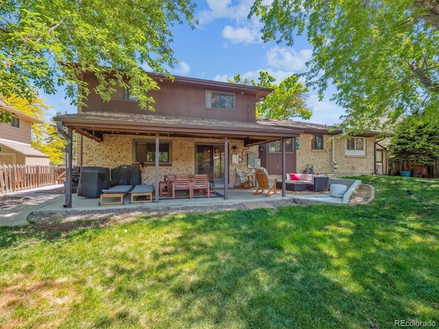 7379 S Lafayette Cir W, Centennial, CO 80122 - rear view of property featuring outdoor lounge area, a patio, and brick siding