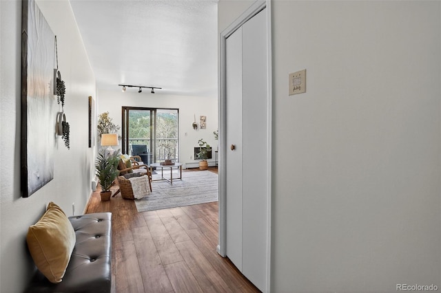 31270 John Wallace Rd Unit 302, Evergreen, CO 80439 - corridor featuring wood finished floors and track lighting