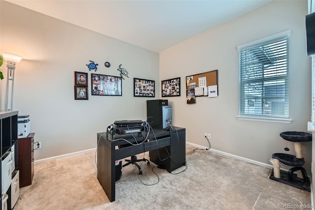 office with light colored carpet and baseboards