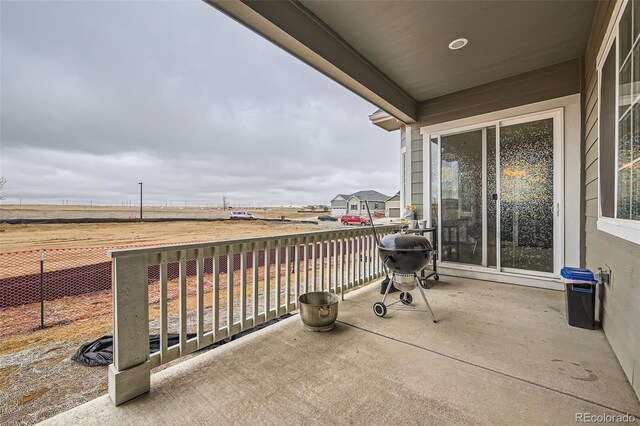 view of patio featuring fence