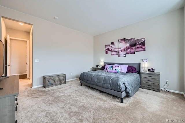 bedroom with baseboards and carpet floors