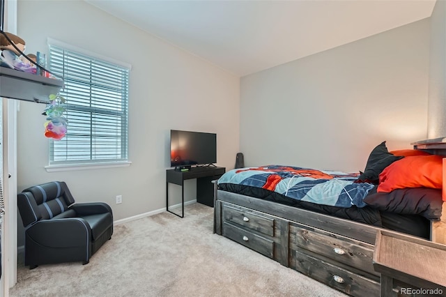 carpeted bedroom with baseboards