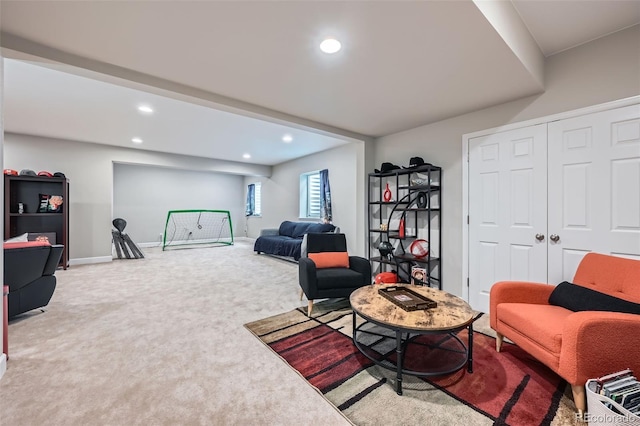 carpeted living area with recessed lighting and baseboards