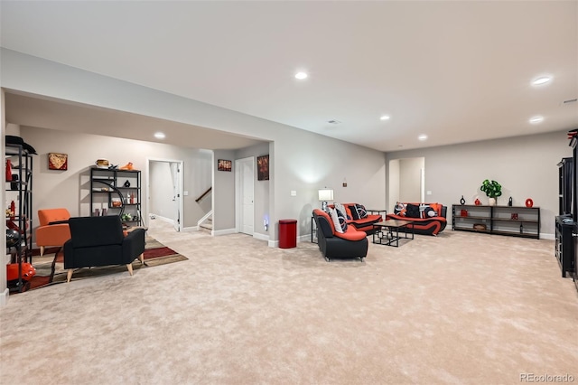 living room with stairs, recessed lighting, light colored carpet, and baseboards