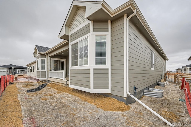 view of property exterior featuring fence