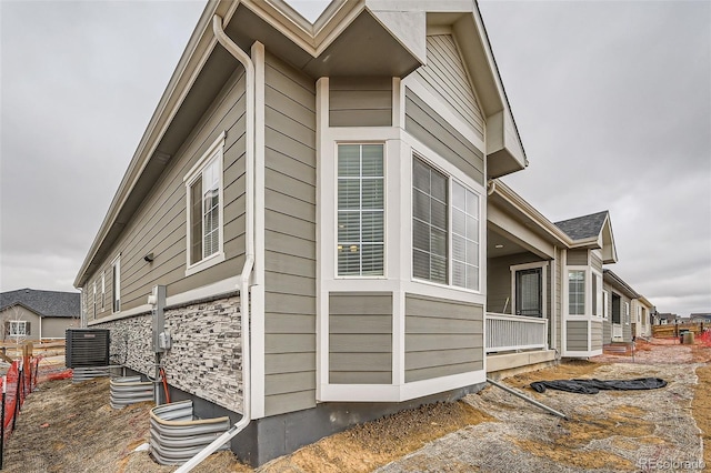 view of home's exterior featuring cooling unit