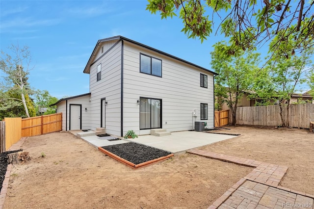 3575 S Ouray St, Aurora, CO 80013 - back of house featuring a patio area, a fenced backyard, and central AC unit