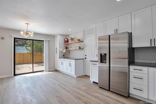 3575 S Ouray St, Aurora, CO 80013 - kitchen featuring stainless steel fridge, a chandelier, backsplash, light wood-type flooring, and recessed lighting