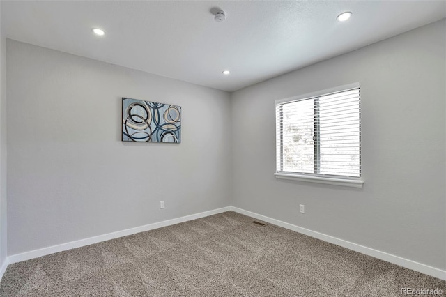 3575 S Ouray St, Aurora, CO 80013 - carpeted empty room with baseboards, recessed lighting, and a smoke detector