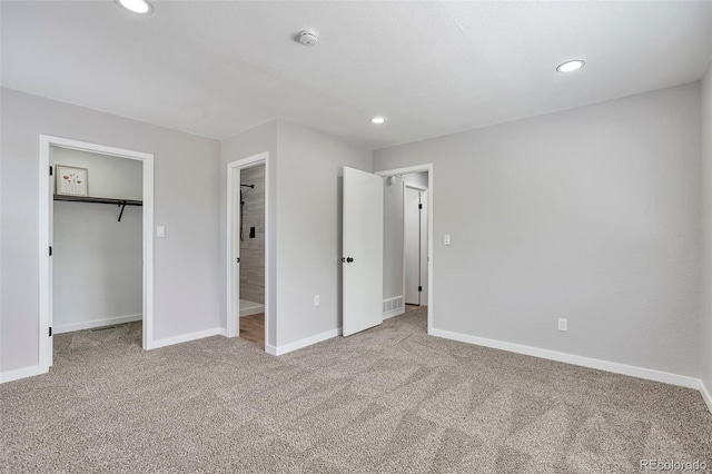 3575 S Ouray St, Aurora, CO 80013 - unfurnished bedroom with carpet, recessed lighting, baseboards, a walk in closet, and a closet