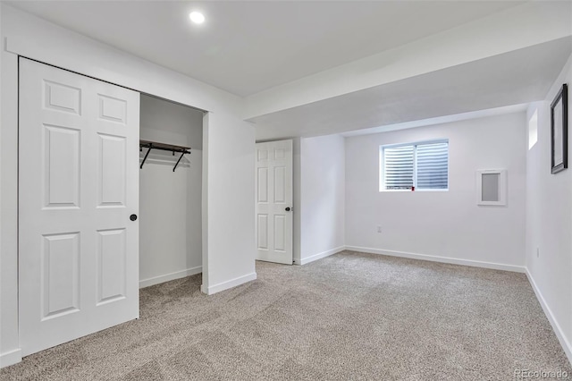 3575 S Ouray St, Aurora, CO 80013 - unfurnished bedroom with light colored carpet, baseboards, and a closet