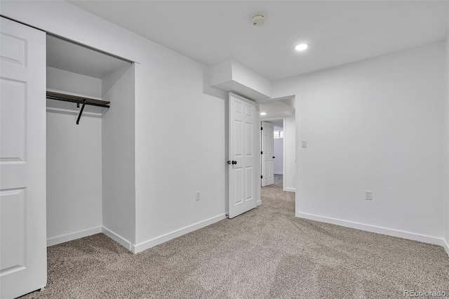 3575 S Ouray St, Aurora, CO 80013 - unfurnished bedroom with light colored carpet, baseboards, and recessed lighting