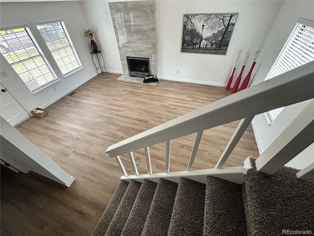 3575 S Ouray St, Aurora, CO 80013 - stairs featuring wood finished floors, baseboards, and a premium fireplace