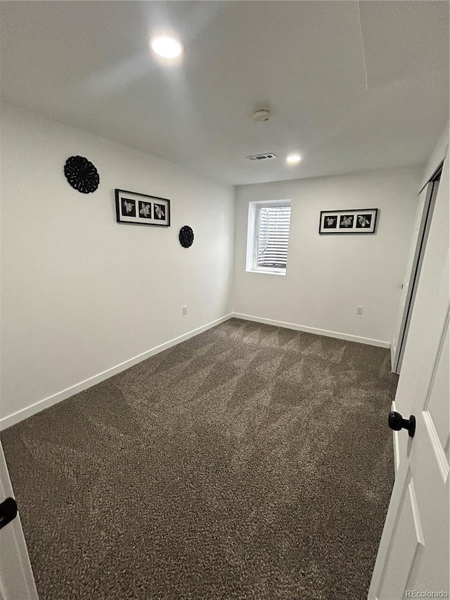 3575 S Ouray St, Aurora, CO 80013 - unfurnished room featuring baseboards, dark colored carpet, recessed lighting, and a smoke detector