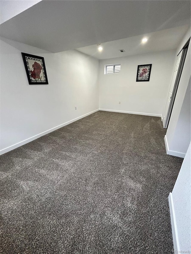 3575 S Ouray St, Aurora, CO 80013 - basement with baseboards, dark colored carpet, and recessed lighting