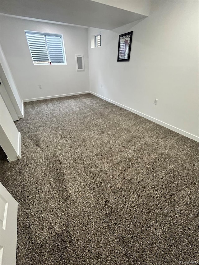 3575 S Ouray St, Aurora, CO 80013 - empty room featuring baseboards and dark colored carpet