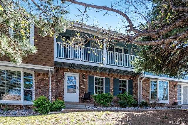 2437 E Geddes Pl, Centennial, CO 80122 - view of front facade with a balcony and brick siding