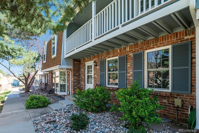 2437 E Geddes Pl, Centennial, CO 80122 - view of property exterior featuring brick siding and a balcony