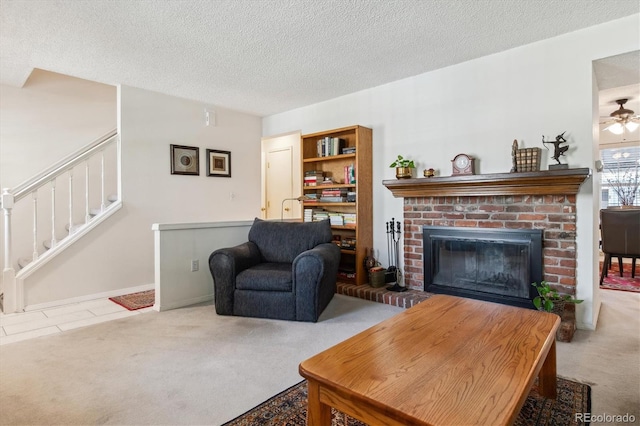 2437 E Geddes Pl, Centennial, CO 80122 - living area with carpet, a brick fireplace, a textured ceiling, stairs, and ceiling fan