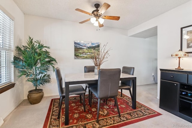 2437 E Geddes Pl, Centennial, CO 80122 - carpeted dining area with a ceiling fan and a textured ceiling