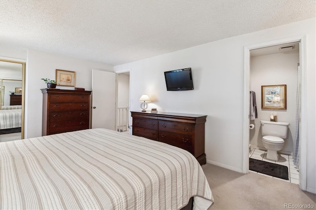 2437 E Geddes Pl, Centennial, CO 80122 - bedroom with carpet, a textured ceiling, baseboards, and ensuite bath