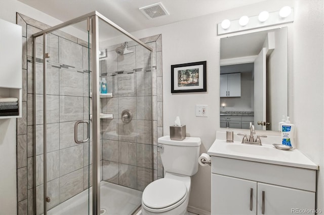 2437 E Geddes Pl, Centennial, CO 80122 - bathroom with toilet, vanity, and a shower stall