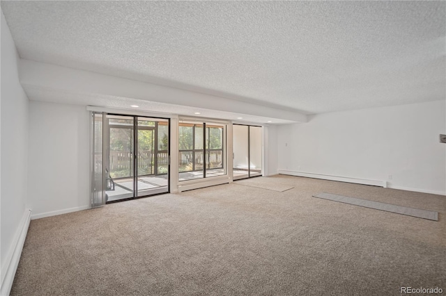 spare room featuring carpet, a textured ceiling, and a baseboard radiator