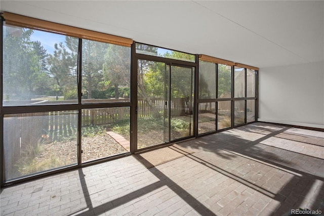 unfurnished sunroom featuring a healthy amount of sunlight