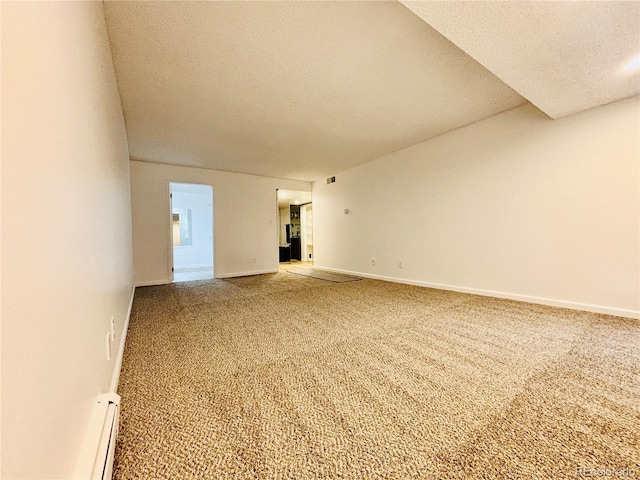 interior space featuring a textured ceiling and a baseboard heating unit