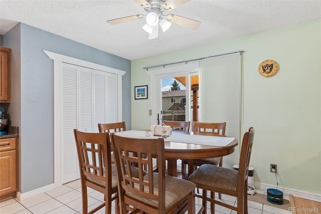 4929 Witches Hollow Ln, Colorado Springs, CO 80911 - dining area with ceiling fan, light tile patterned floors, and a textured ceiling