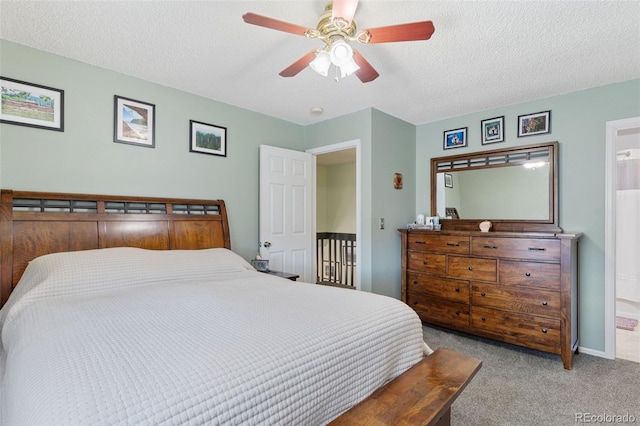 4929 Witches Hollow Ln, Colorado Springs, CO 80911 - bedroom with carpet floors, a textured ceiling, ceiling fan, and connected bathroom