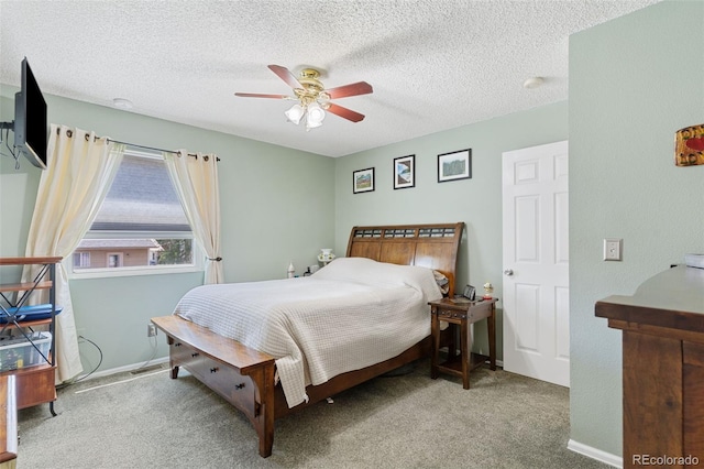 4929 Witches Hollow Ln, Colorado Springs, CO 80911 - bedroom featuring carpet, a textured ceiling, and a ceiling fan