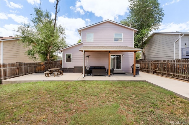 4929 Witches Hollow Ln, Colorado Springs, CO 80911 - rear view of house featuring a patio area, outdoor lounge area, and a fenced backyard