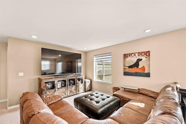 carpeted living room featuring baseboards and recessed lighting