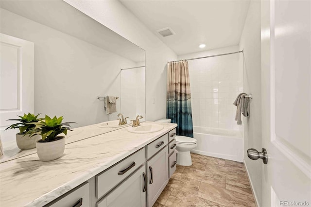 full bathroom featuring shower / bath combo, visible vents, vanity, and toilet