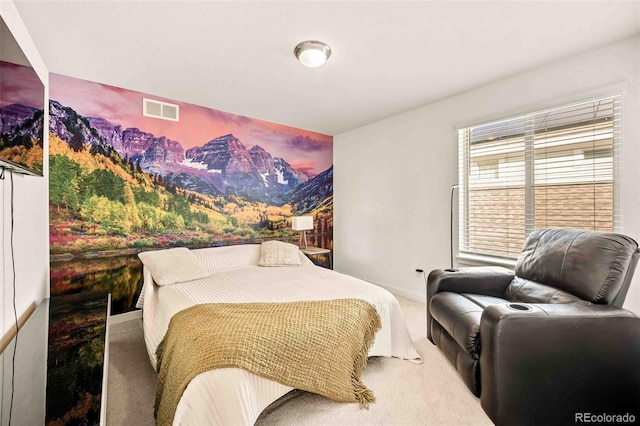 carpeted bedroom featuring visible vents