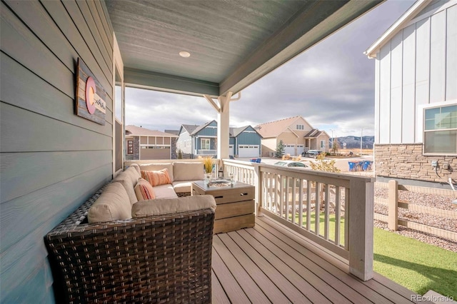 deck featuring a residential view and outdoor lounge area