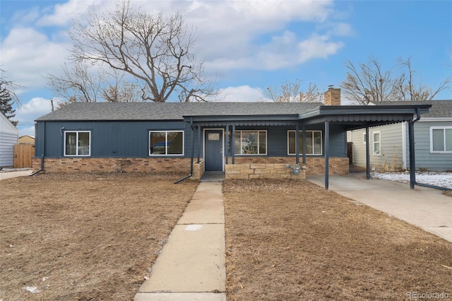 ranch-style home featuring a carport