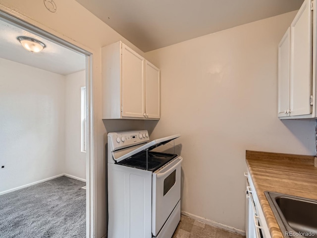 1850 W 50th Ave, Denver, CO 80221 - kitchen with white electric stove and white cabinetry