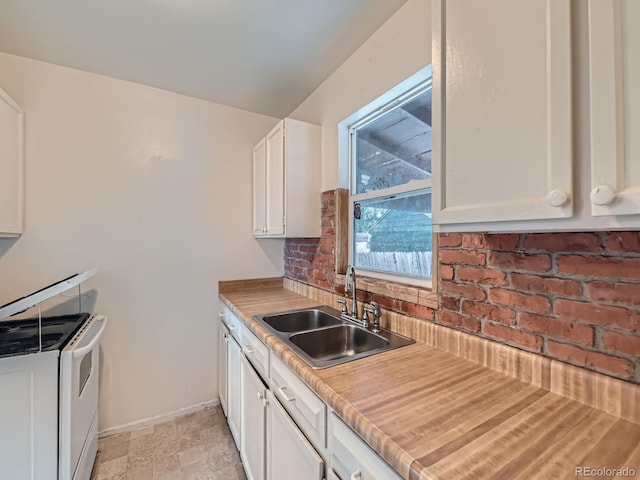 1850 W 50th Ave, Denver, CO 80221 - kitchen featuring white electric range, white cabinets, light countertops, backsplash, and light stone finish flooring