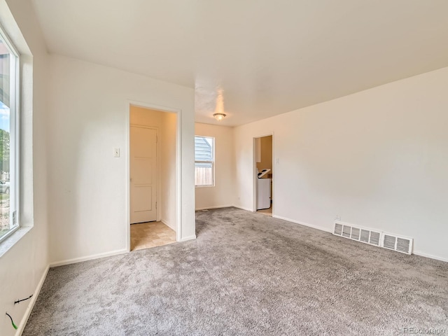 1850 W 50th Ave, Denver, CO 80221 - carpeted empty room with baseboards
