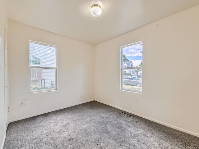 1850 W 50th Ave, Denver, CO 80221 - carpeted empty room featuring baseboards