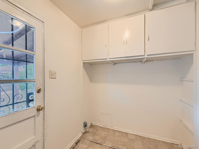 1850 W 50th Ave, Denver, CO 80221 - washroom with cabinet space and hookup for an electric dryer